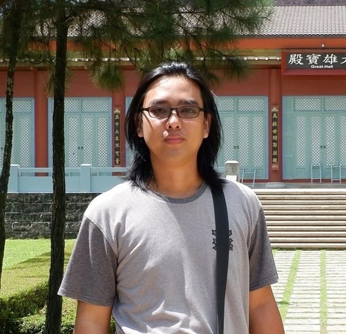 Paulo Bautista standing outside a traditional building