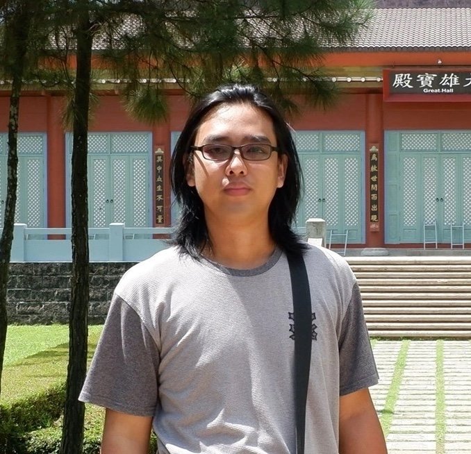 Paulo Bautista standing outside a traditional building